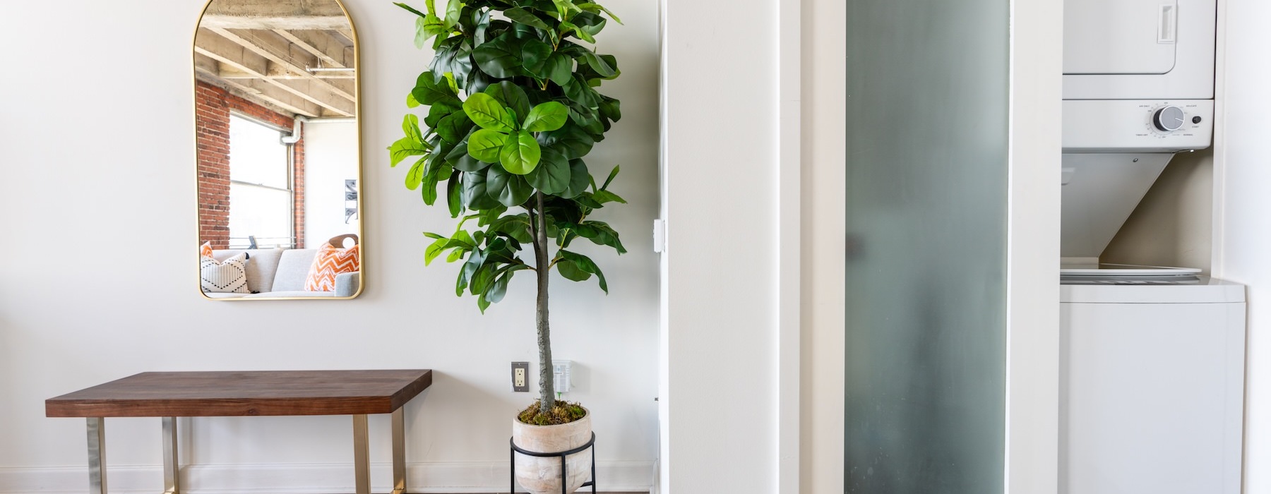 a hallway with a washer and dryer