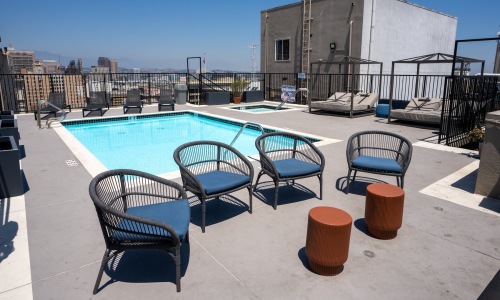 a swimming pool with lounge chairs