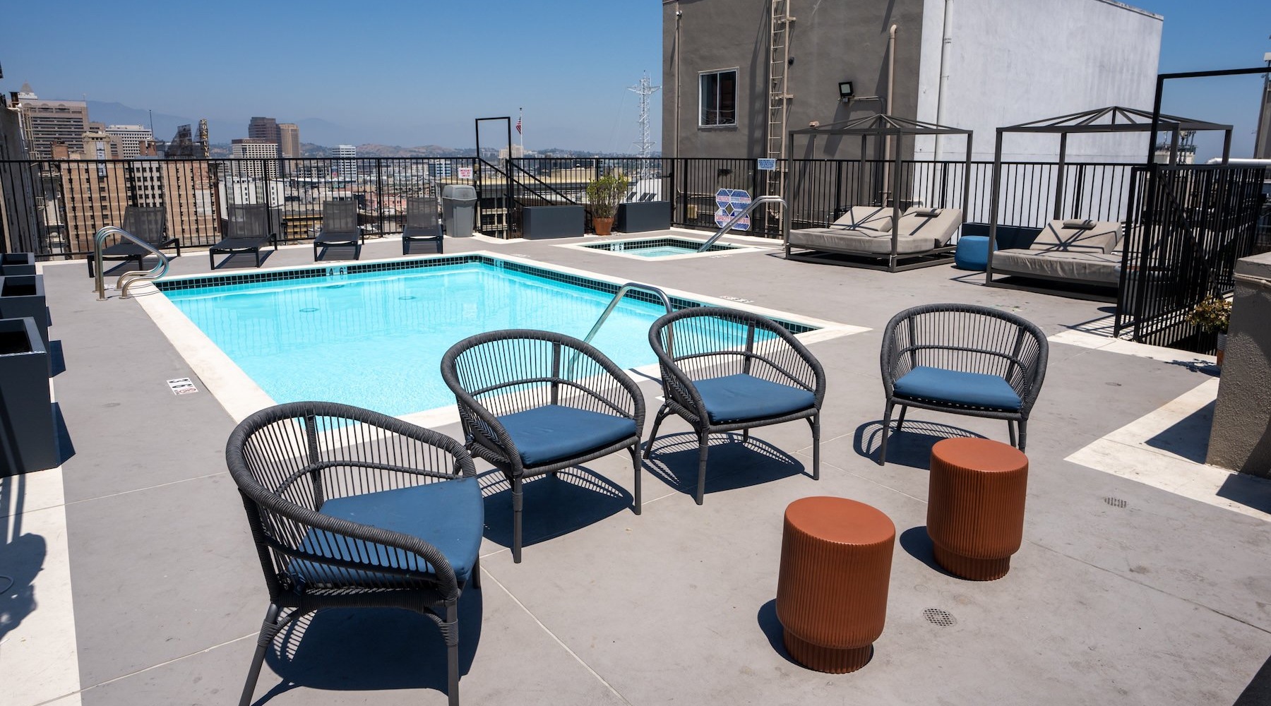 a swimming pool with lounge chairs