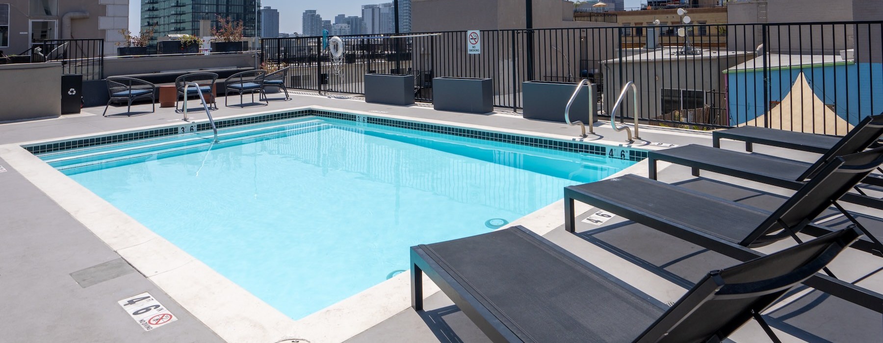 a pool with chairs around it