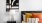 a bedroom with a bed and a lamp on a table