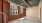 a room with a brick wall and a window