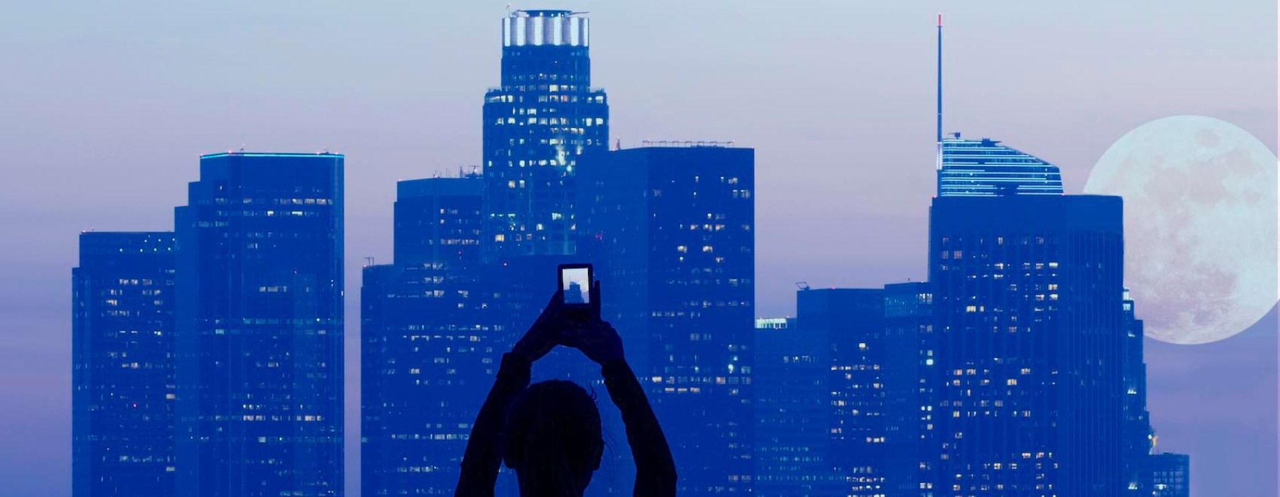 a person taking pictures of a building