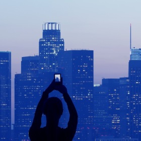 a person taking pictures of a building