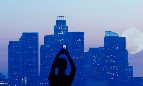 a person taking pictures of a building